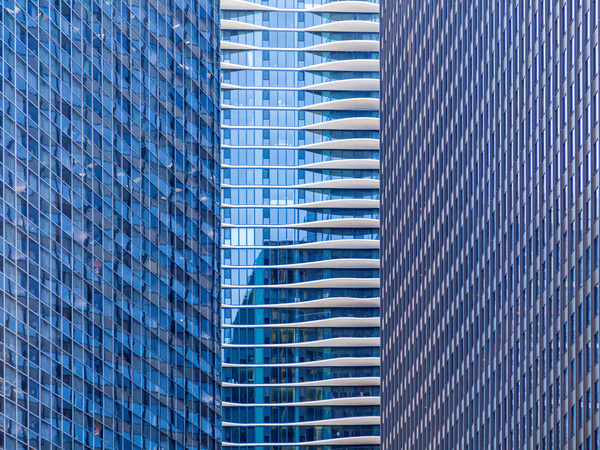Distinctive hotel between skyscrapers by Steve Heap