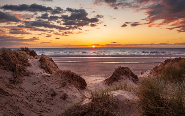 Sunset over Formby Beach through sand dunes by Steve Heap