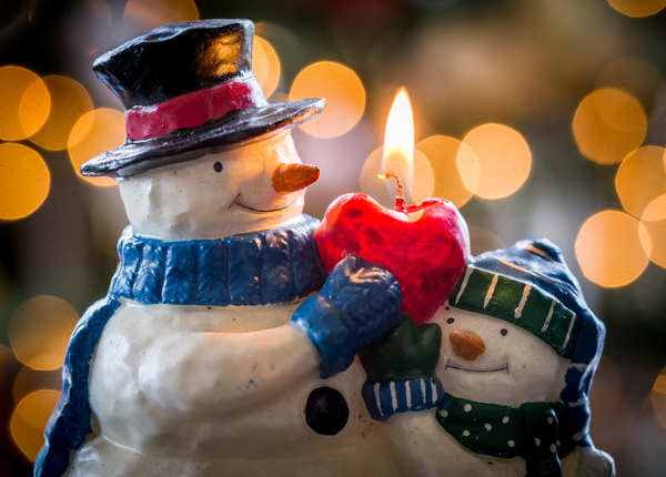 Christmas snowmen candle at xmas by Steve Heap