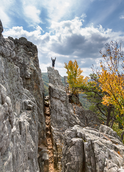 Climber on top of Seneca Rocks by Steve Heap