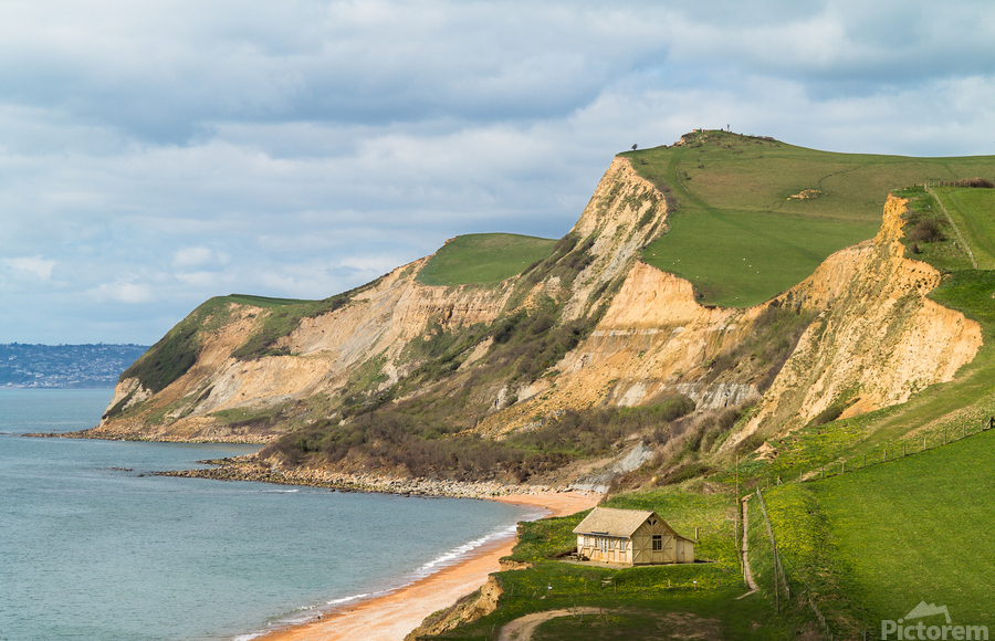 Cottage by cliffs at West Bay Dorset in UK  Print