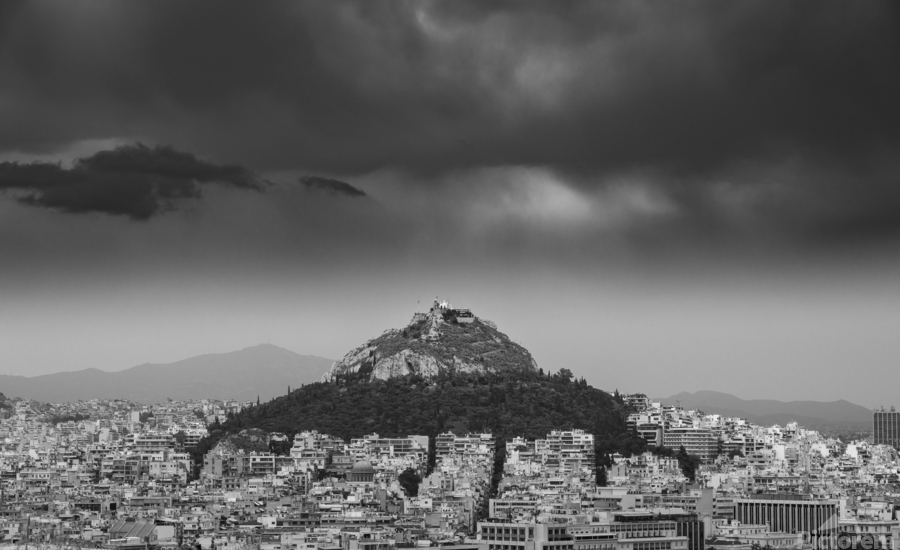 Lycabettus hill rises above Athens in a storm  Print