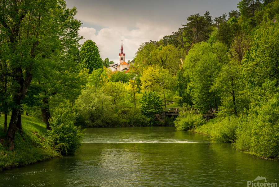 Church in the woods above peaceful river  Print