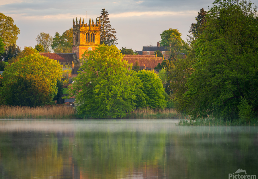 Sunset view across Ellesmere Mere in Shropshire to church  Print