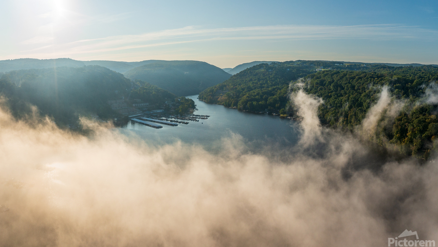Mist rises from Cheat Lake in the early morning as the sun rises  Print