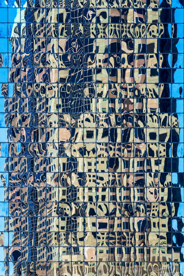 Complex reflections of a modern skyscraper in St Louis   Print