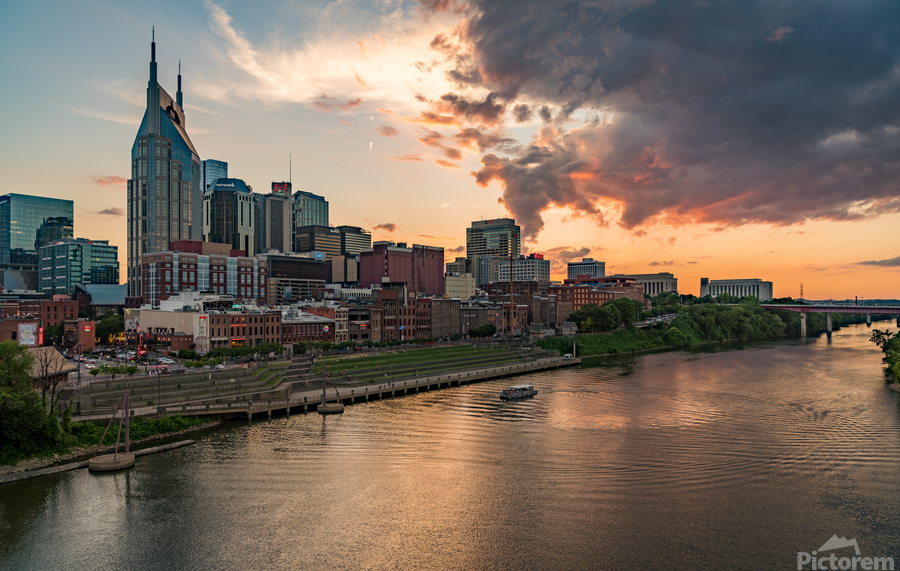 Skyline of Nashville in Tennessee during dramatic sunset over the river  Print