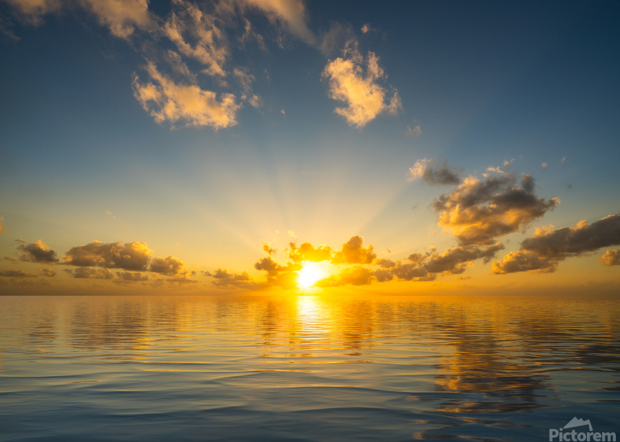 Beautiful sunset reflected in a calm peaceful ocean  Print