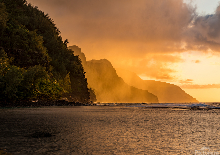 Sunset over the receding mountains of the Na Pali coast of Kauai  Print
