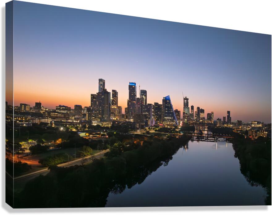 Orange skies behind skyline of Austin Texas as sun starts to ris Canvas Print