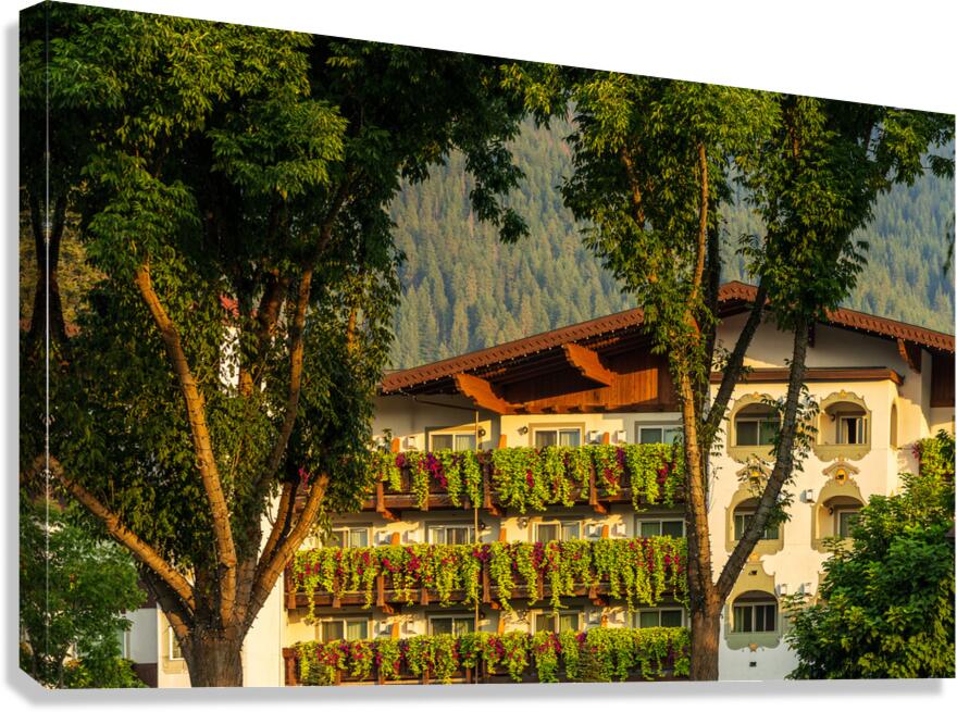 Flower strewn balconies of a hotel in Alpine village of Leavenwo Canvas Print