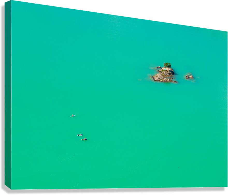 Three paddleboards float away from island in Diablo Lake in Nort Canvas Print