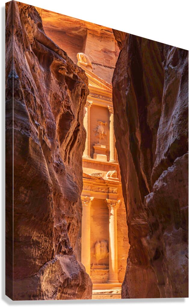 Petra Treasury building facade seen through narrow gorge Canvas Print