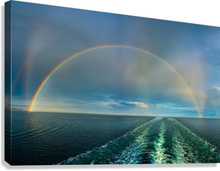 Dramatic double rainbow over wake of ship  Canvas Print