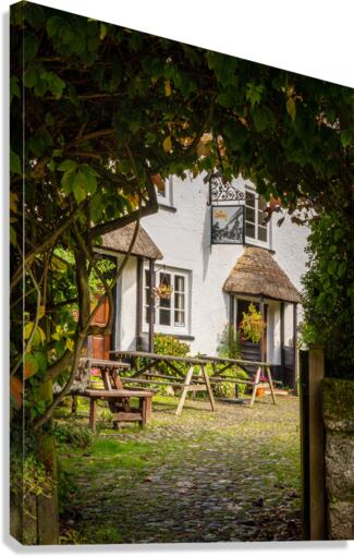Thatched pub garden in Lustleigh in Devon  Canvas Print