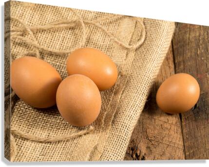 Freshly laid organic eggs on wooden bench  Impression sur toile