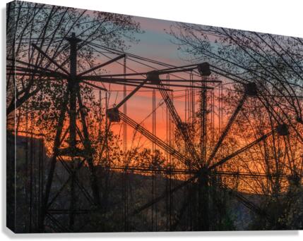 Ferris Wheel ride at abandoned funfair  Canvas Print