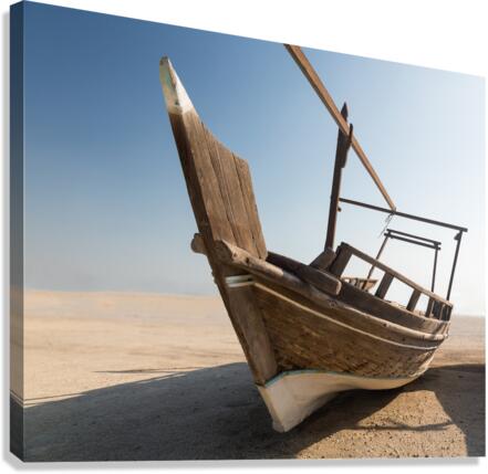 Fishermans boat or dhow on sand Canvas Print
