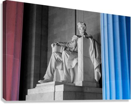 President Lincoln statue with pillars lit in red and blue  Canvas Print