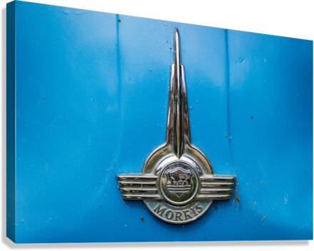 Old chrome Morris badge on blue car  Canvas Print