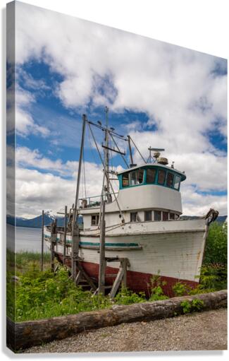 Historic but rotting fishing boat by ocean at Icy Strait Point  Canvas Print