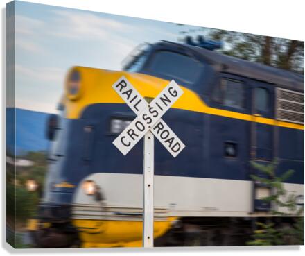 Diesel engine with railroad crossing sign  Canvas Print