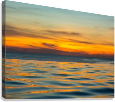 Infinity edge pool with sea underneath sunset Canvas Print