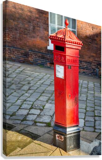 Victoria era red post office mailbox in street  Canvas Print