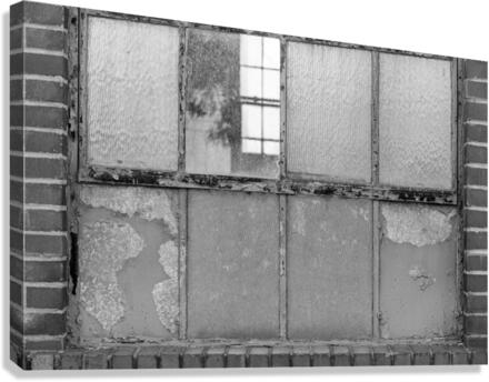 Old rusty window in warehouse in black and white  Canvas Print