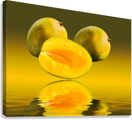 Two mangoes and one cut mango reflecting  Impression sur toile