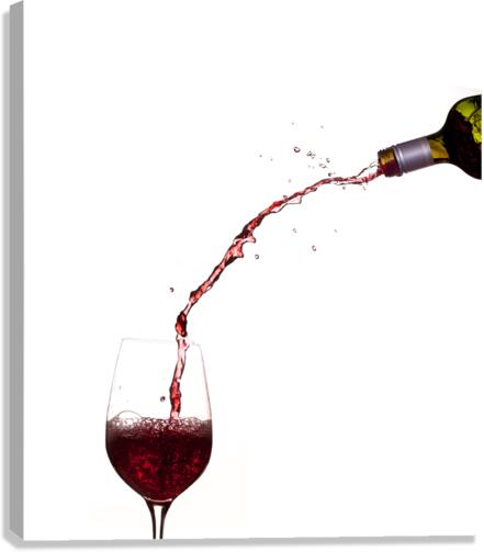 Wine pouring from bottle into glass  Canvas Print