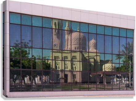 Reflection of the Jumeirah Mosque in Dubai in the windows of an   Canvas Print