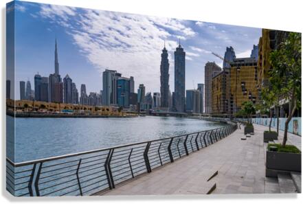 Low rise homes in front of modern apartments of Dubai Downtown d  Impression sur toile