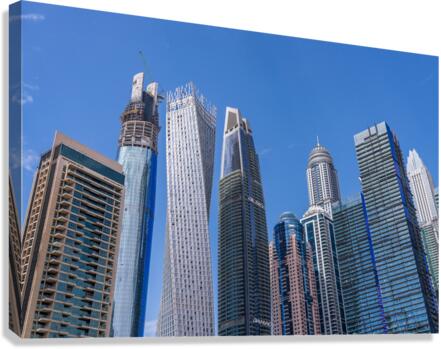 Cayan Tower among tall buildings on waterfront at Dubai Marina  Impression sur toile