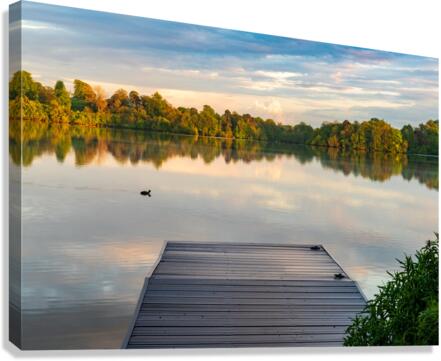 View across the Ellesmere Mere to a clear reflection of distant   Canvas Print