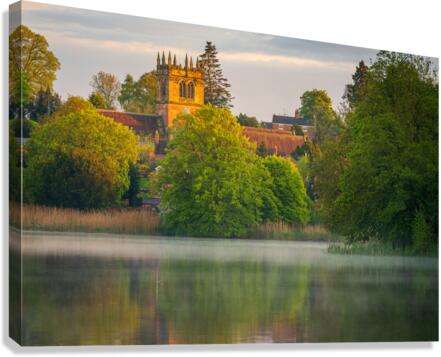 Sunset view across Ellesmere Mere in Shropshire to church  Canvas Print