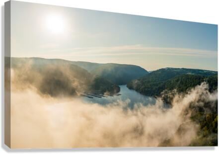 Mist rises from Cheat Lake in the early morning as the sun rises  Canvas Print