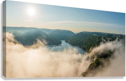 Mist rises from Cheat Lake in the early morning as the sun rises  Canvas Print