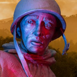 Close up of head of soldier statue in jungle