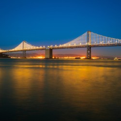 San Francisco Bay bridge illuminated at night