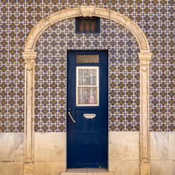 Blue door in ceramic tiled home in Lisbon
