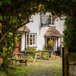 Thatched pub garden in Lustleigh in Devon