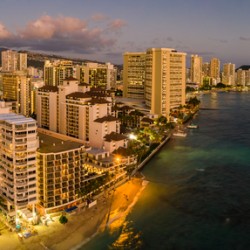 Aerial view of Waikiki beach towards Diamond Head at sunset 