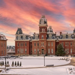 Sunset over snow covered Woodburn Hall at WVU