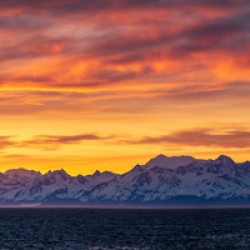 Sunset by Mt Fairweather and the Glacier Bay National Park in Al