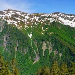 View from Mount Roberts toward Mt Juneau with waterfall in Alask