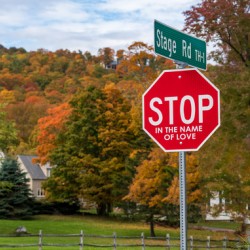 Stop in the name of love road sign in Vermont