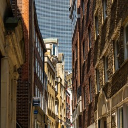 Lovat Lane in the City of London with skyscrapers filling sky