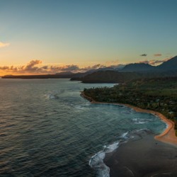 Aerial panorama of sunrise over Tunnels Beach Kauai Hawaii