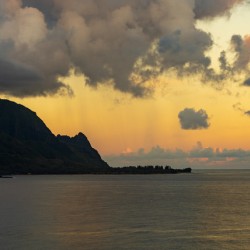Sunrise over Hanalei bay with silhouette of north shore peaks